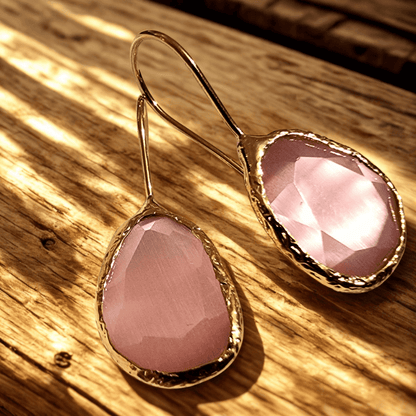 roze cateye oorbellen met zilveren rand, boho stijl, uniek design