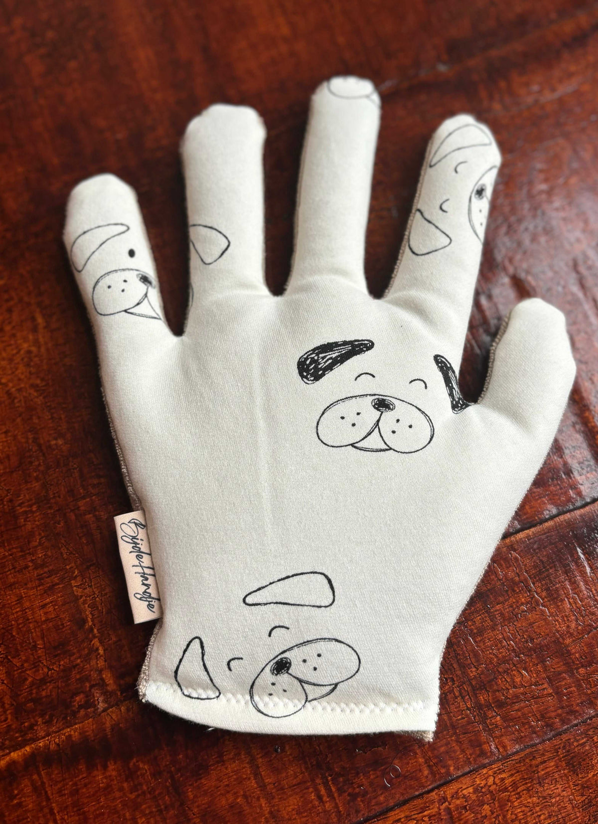 Hondendessin op zachte handwarmertje voor ontspanning en troost