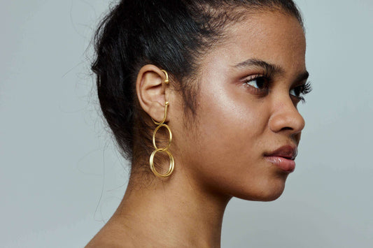 Gouden oorbel met cirkelvormige design, handgemaakt, verstelbaar