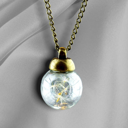 Unieke paardebloemzaad halsketting met glazen bol en bronzen ketting
